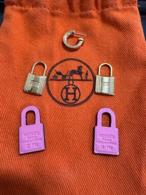 LOST EARING - Hermes Pink and Gold Padlock Charm Earrings on Orange Pouch